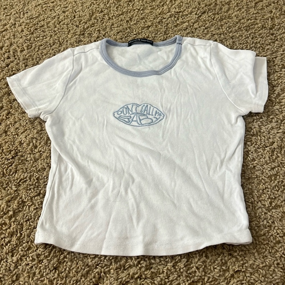 white and light blue “don’t call me baby” brandy melville top